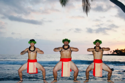 a group of people on a beach near a body of water