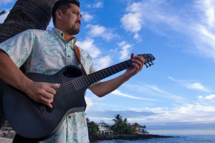 a man holding a guitar